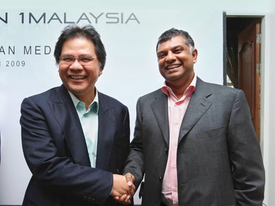 ALL FOR ONE: MAS MD & CEO Datuk Seri Idris Jala (left) and AirAsia group CEO Datuk Seri Tony Fernandes, who are fierce rivals  often at odds in the aviation business, in a chummy mood at the launch of Yayasan 1Malaysia yesterday. They are among eight prominent Malaysians who formed the non-profit foundation dedicated to national unity initiatives. Photo by Mohd Izwan Mohd Nazam